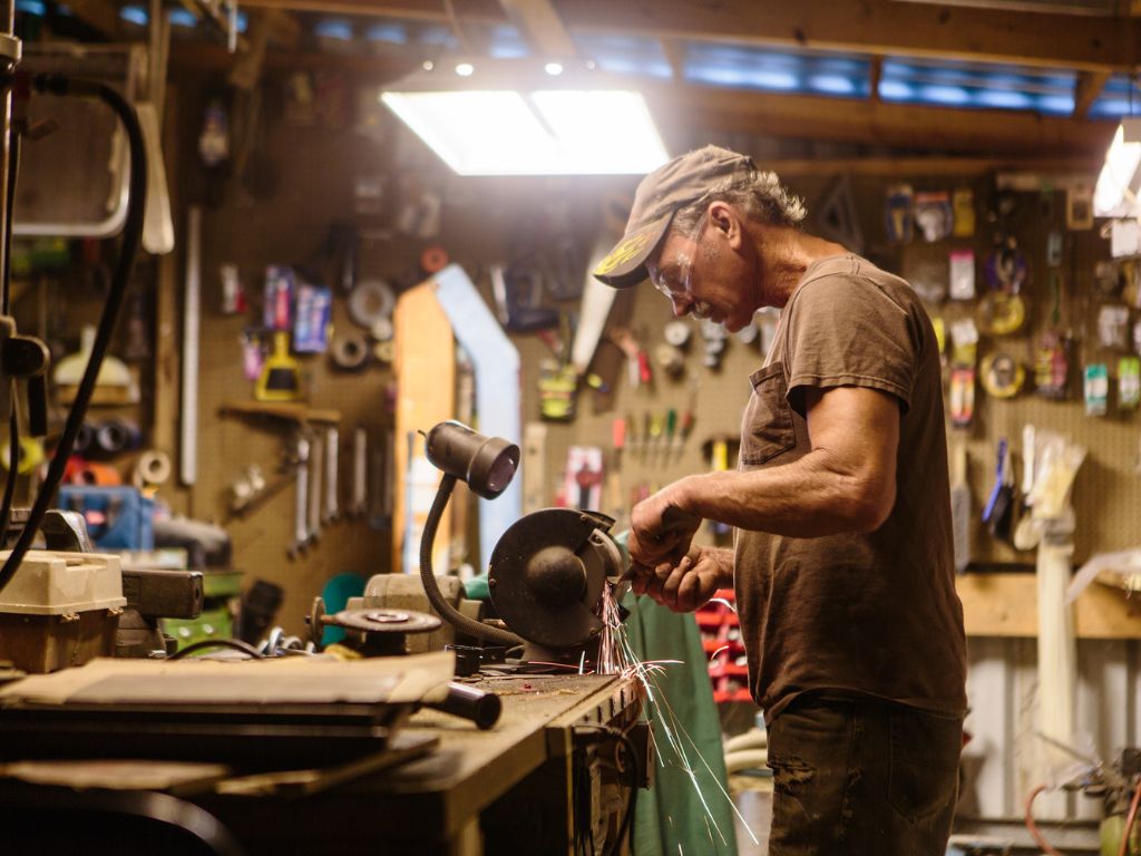 Retired man works in a shop.