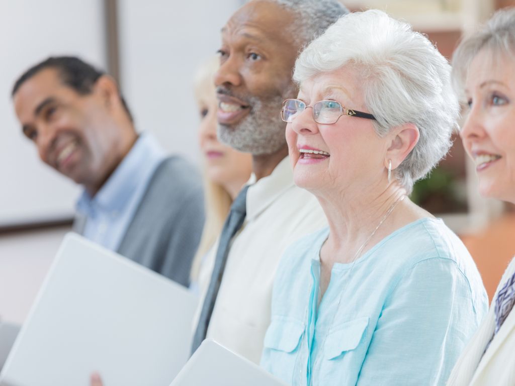 Senior woman makes friends at part-time job.