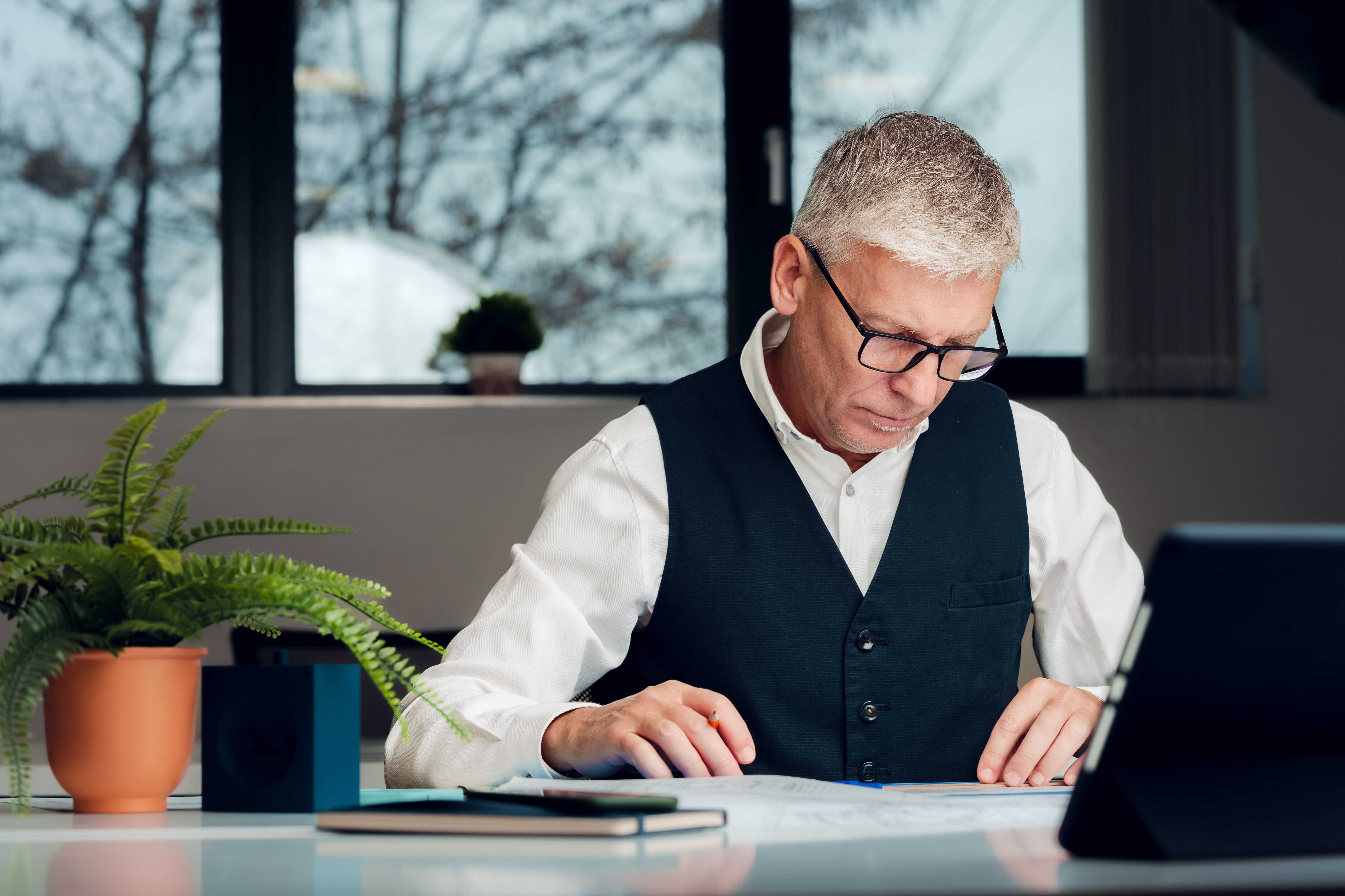 Man working with plans at office